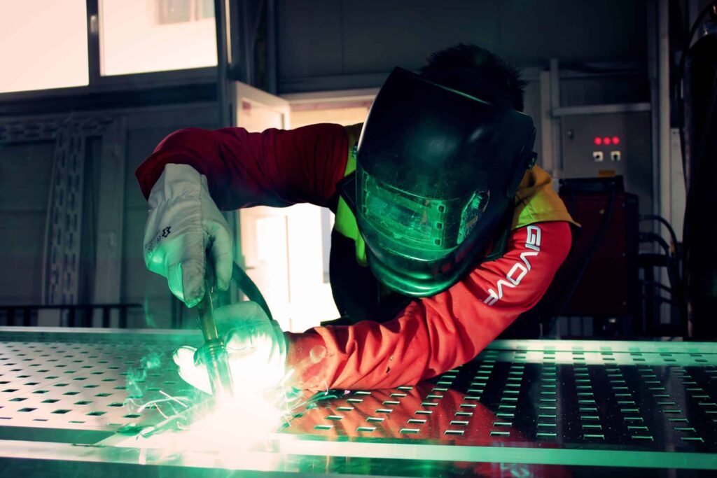 person welding metal