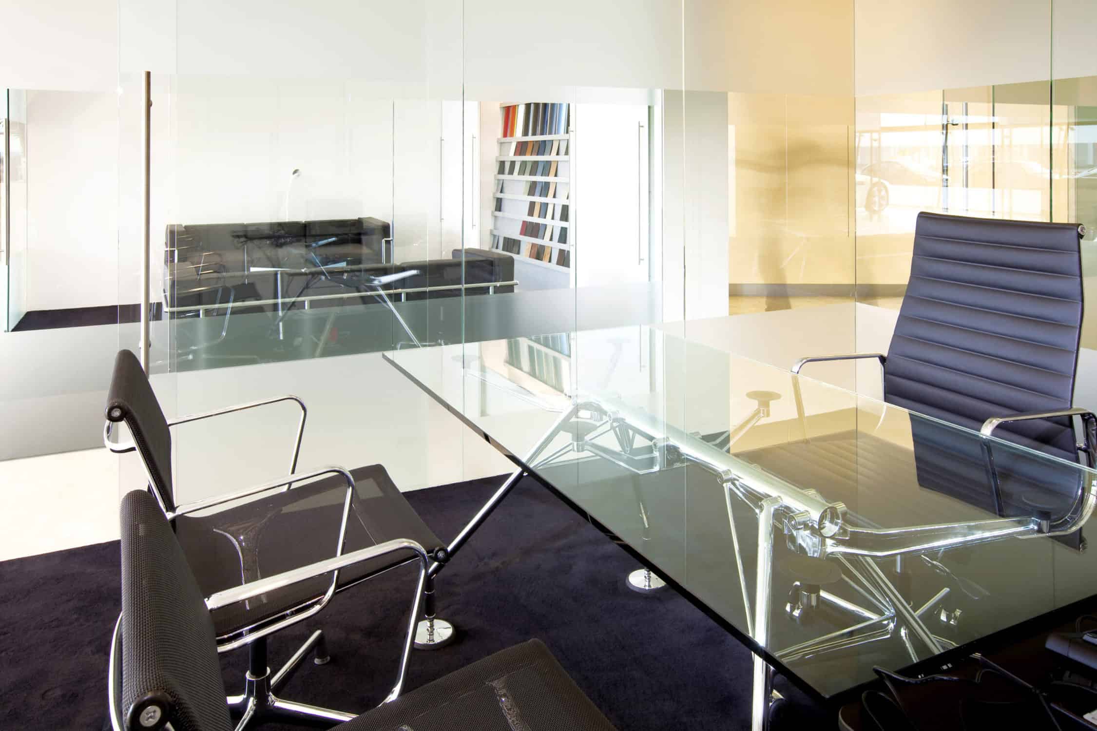 Modern office meeting room with a glass conference table