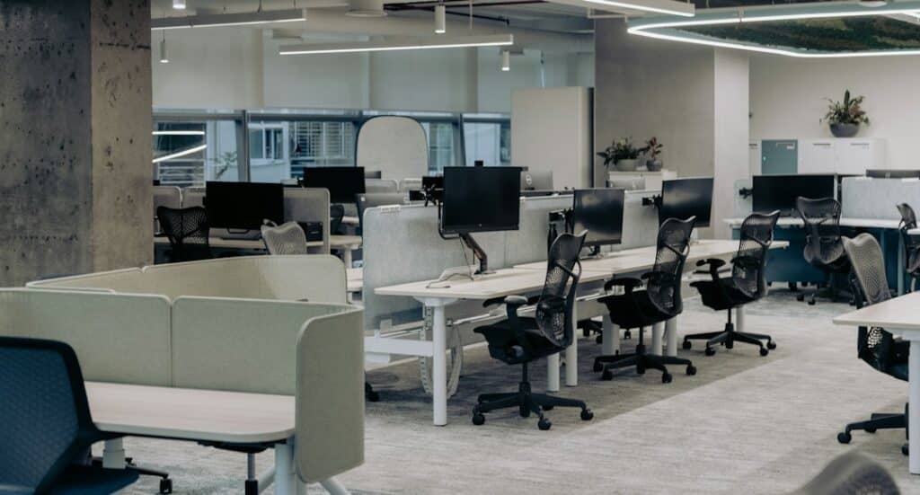 Empty office desks illustrating employee turnover
