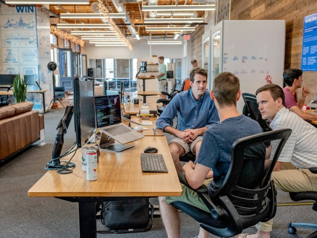 Professionals collaborating in a modern office meeting about hiring and recruiting