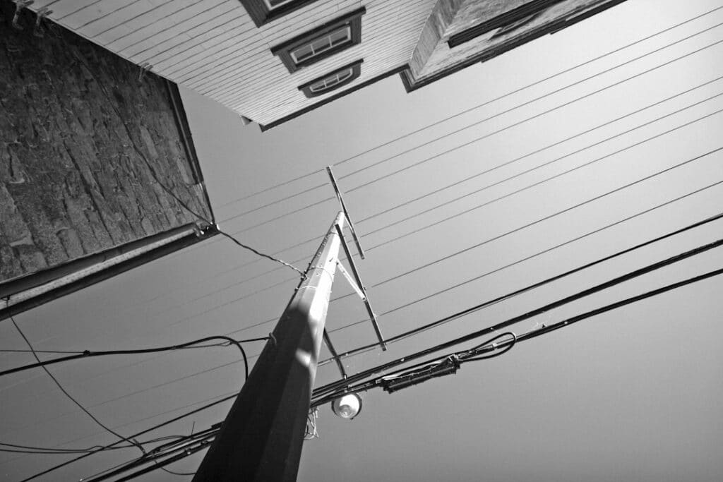 Overhead cables on a utility pole, the work of make ready engineers