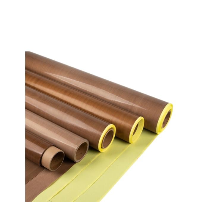 Rolls of brown PTFE fiberglass fabric tape with yellow release liner, used for heat sealing and chemical-resistant applications
