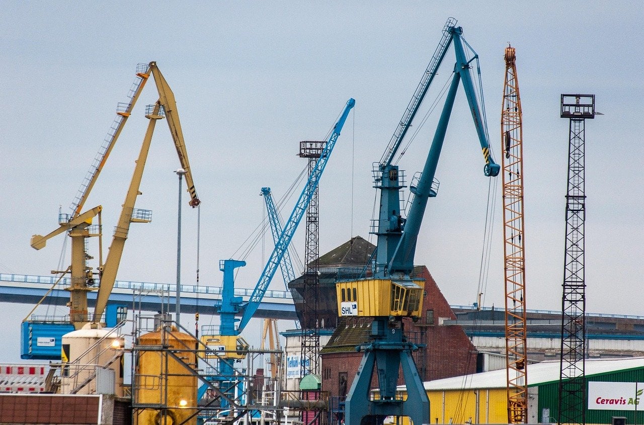 Cargo cranes at an industrial port used for freight and distribution logistics